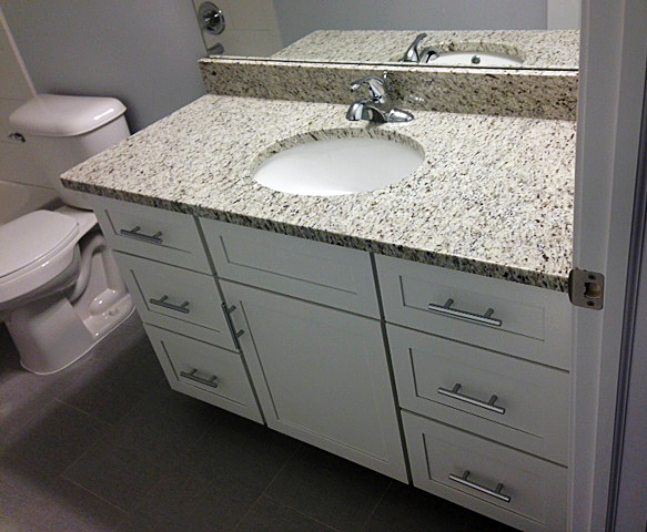 Bathroom vanity with undermount sink and granite counter top
