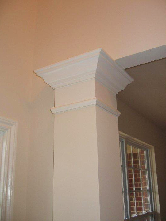 Decorative column with crown molding