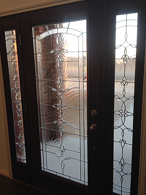 Entry door with inlaid glass