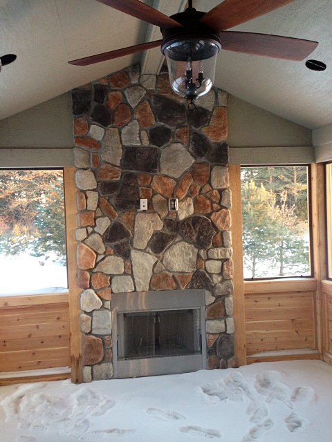 Exterior fireplace in three season room