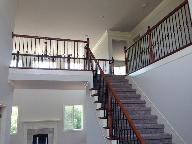 Foyer portion of split staircase, view from foyer