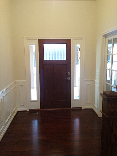 Foyer with craftsman front door