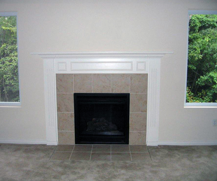 Interior fireplace with white painted mantel