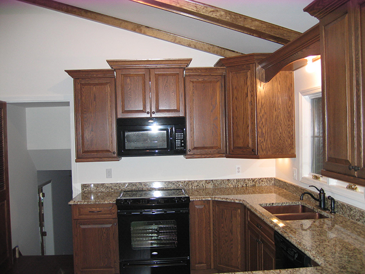 Kitchen featuring a ceiling with accent columns
