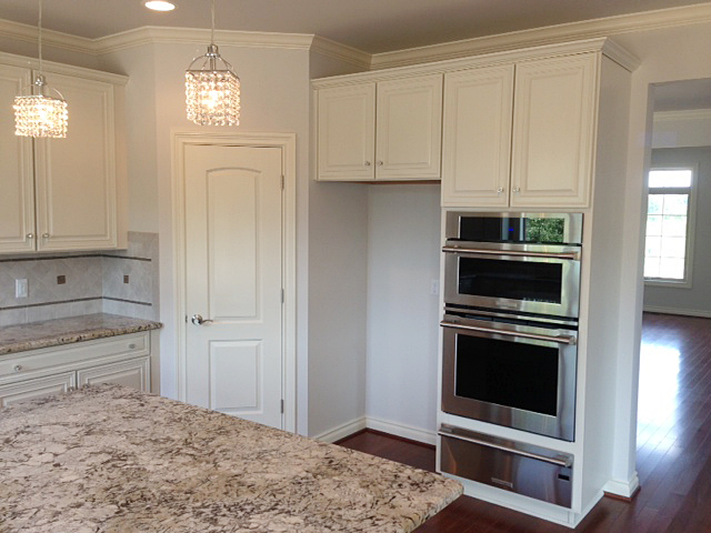 Kitchen with centrally located pantry