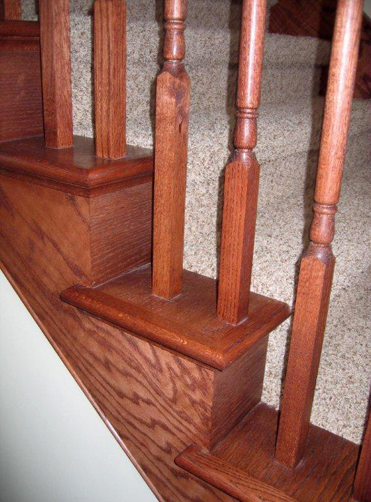 Oak railing spindles on oak stair caps