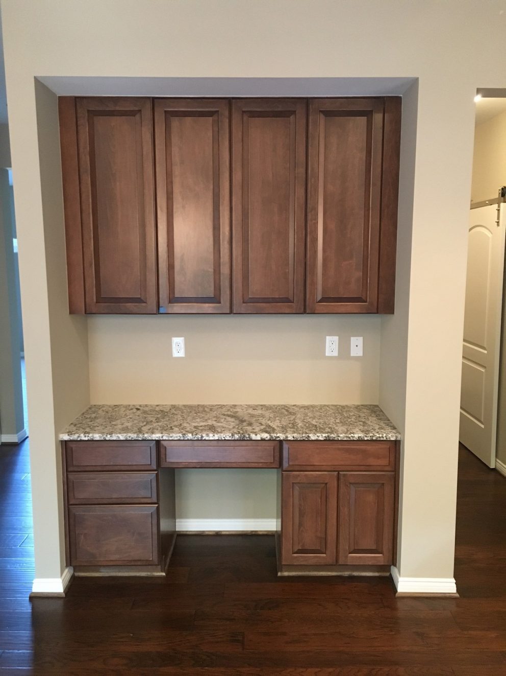 Desk area with additional kitchen cabinetry