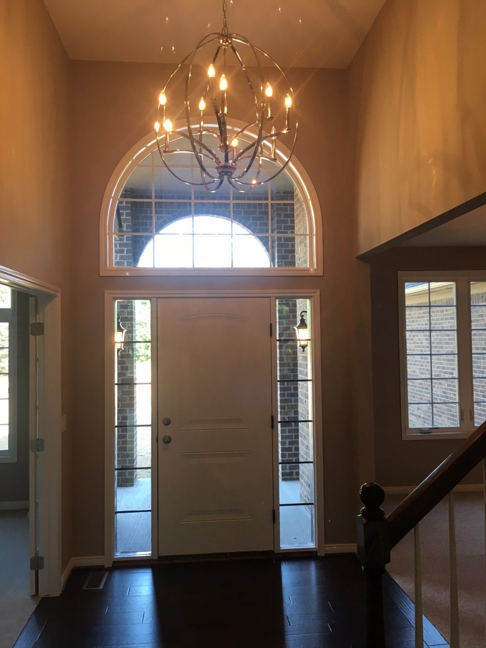 Foyer with high ceilings and chandelier