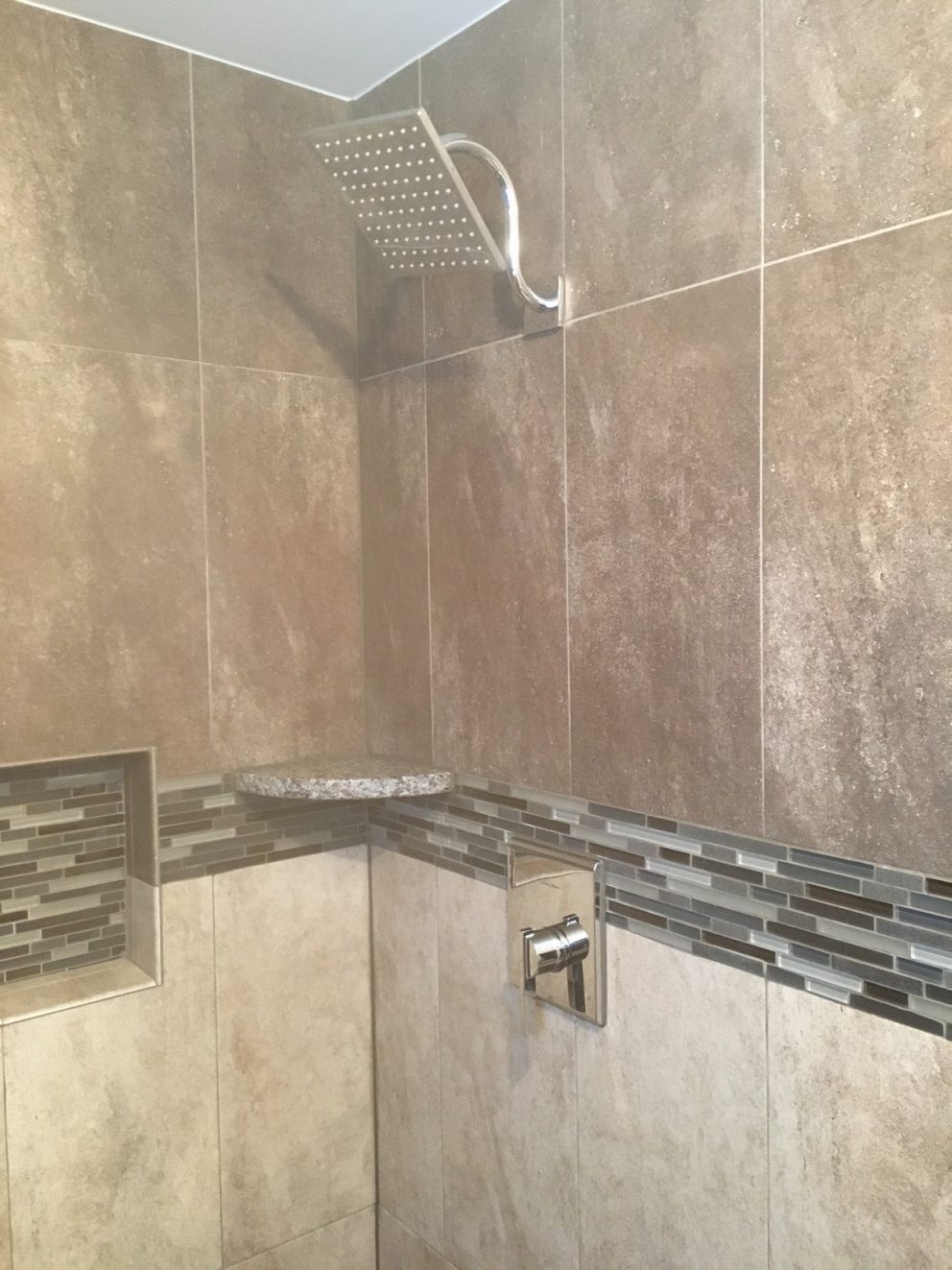 Master bath shower with tiled nich and rain shower head