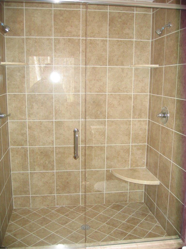 Tiled shower with glass door and dual shower heads
